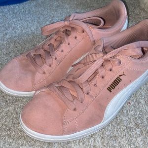 Pink suede pumas
